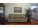 Comfortable living room featuring hardwood floors, a sofa, and decor at 3422 Sycamore Dr, Columbus, IN 47203