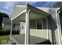 This home boasts a covered front porch area at 3508 Brouse Ave, Indianapolis, IN 46218