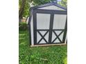 Modern shed with gray and black trim, offering extra storage in the backyard at 3535 Parrish Ct, Indianapolis, IN 46227