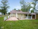 Spacious backyard with a patio, partial fence and lots of green space at 4219 Mathews Ave, Indianapolis, IN 46227