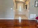 Inviting entryway with neutral walls, white trim, tile flooring, and decorative wainscoting at 6334 Winslow Dr, Indianapolis, IN 46237