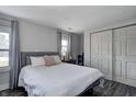 Bright bedroom with a large bed, soft gray linens, and a view from the windows at 725 2Nd St, Shelbyville, IN 46176