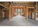Unfinished grand foyer showcasing a dramatic staircase and large windows for natural light at 7843 E Triple Crown Ln, Camby, IN 46113