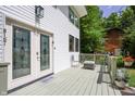 Side deck offers a cozy outdoor seating area with lovely landscaping and access to the front door at 8167 Center Lake Rd, Nineveh, IN 46164