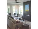 Stylish living room with a modern fireplace, comfortable couch, and large windows offering ample natural light at 955 Dorman St, Indianapolis, IN 46202