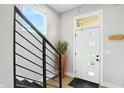 Bright foyer featuring modern staircase, stylish decor, and a welcoming atmosphere at 1406 Linden St, Indianapolis, IN 46203