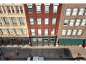 Aerial view of a historic building featuring Meridian Lofts with street and sidewalk view at 207 S Meridian St # 2F, Indianapolis, IN 46225