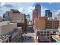 Beautiful cityscape with tall buildings on a sunny day with vehicles on the street at 207 S Meridian St # 2F, Indianapolis, IN 46225