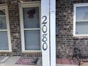 Close up of the house number '2080' displayed on a brick facade at 2080 Miracle Dr, Columbus, IN 47201