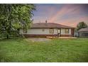Inviting backyard with a wooden deck and partially fenced yard, ideal for relaxing and enjoying the outdoors at 248 Eastview Dr, Bargersville, IN 46106