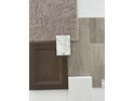A curated selection of interior finish materials featuring stone, carpet, wood floors, and door stain at 289 N Bur Oak Dr, Mooresville, IN 46158