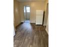 Kitchen featuring wood-look floors and white refrigerator at 3059 5Th E Ave, Indianapolis, IN 46221