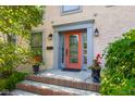 Elegant front door with decorative glass, stylish sidelights, and manicured landscaping at 4224 River Rd, Columbus, IN 47203