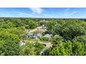 Aerial perspective of the property nestled in a lush, green neighborhood with visible street access at 4708 Fletcher Ave, Indianapolis, IN 46203