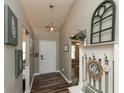 Welcoming entryway with wood floors, neutral paint, and decorative accents at 59 Millet Ct, Danville, IN 46122