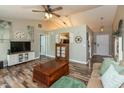 Comfortable living room with vaulted ceilings and wood-look floors at 59 Millet Ct, Danville, IN 46122