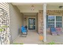 Inviting front porch with classic columns, decorative shutters, and patriotic decor at 958 Denton Ct, Westfield, IN 46074