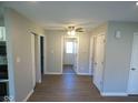 Hallway featuring contemporary flooring and convenient access to multiple rooms at 1155 E Perry St, Indianapolis, IN 46227