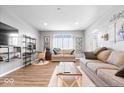 Spacious living room featuring contemporary decor, wood floors, and natural light at 1158 Thistlewood Way, Plainfield, IN 46168