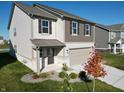 Charming home with neutral siding, a two-car garage, and a professionally landscaped front yard at 1248 Cassine Pl, Greenwood, IN 46143