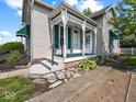 Inviting porch details highlight the entry of this well-maintained home at 146 E Broadway St, Shelbyville, IN 46176