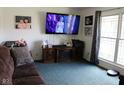 Cozy living room showcases a large window and entertainment center, perfect for relaxing at 1504 Gwinn Ln, Lapel, IN 46051