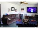 Inviting living room featuring comfortable seating, a television, and charming decor at 1504 Gwinn Ln, Lapel, IN 46051