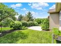 Lush backyard featuring a well-maintained lawn and manicured landscaping, perfect for outdoor enjoyment at 16130 Matlock Cir, Westfield, IN 46074