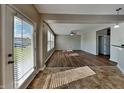 Spacious living room with modern doors offering outdoor access and plenty of natural light at 19533 Chip Shot Rd, Noblesville, IN 46062