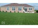 Backyard features a sprawling lawn with windows along the back of the home at 204 St Andrews Ave, Edinburgh, IN 46124