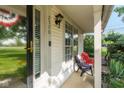 Inviting covered porch with seating area, featuring ample natural light and a welcoming entrance at 2578 Chaseway Ct, Indianapolis, IN 46268