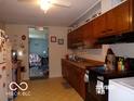Practical kitchen with classic cabinets and standard appliances, offering a comfortable cooking environment at 3213 S Cherokee Rd, Muncie, IN 47302