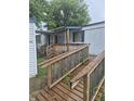 A wooden ramp leads to the entrance of the mobile home at 3216 Memorial N Dr, Elwood, IN 46036