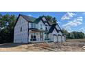 New home featuring a three-car garage and a covered entryway at 6279 Rippling Rock Dr, Plainfield, IN 46168