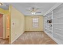 Bright bedroom with built-in shelving and neutral carpet at 6928 Shoals Way, Indianapolis, IN 46237