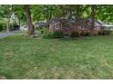 This property boasts lush green landscaping and a well-manicured lawn at 7224 N Tuxedo St, Indianapolis, IN 46240