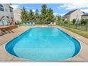 Refreshing in-ground pool surrounded by lounge chairs in a serene backyard setting at 7830 Cross Creek, Avon, IN 46123