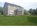 Large backyard with a patio and screened-in porch, perfect for outdoor entertaining at 10166 Ranford Blvd, Fishers, IN 46040