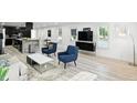Open-concept living space with modern furnishings and an open flow to the kitchen, creating a bright and inviting atmosphere at 1324 E 9Th, Indianapolis, IN 46202