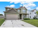 Charming two-story home featuring a well-manicured lawn and attached two-car garage, with a quaint front porch at 1460 Boots Trl, Greenfield, IN 46140