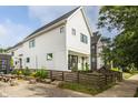 Modern home with an inviting front porch, fenced yard, and charming curb appeal at 1610 N Alabama St, Indianapolis, IN 46202