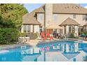 Backyard featuring an in-ground pool, hot tub, and patio with outdoor seating at 2320 Whispering Way, Indianapolis, IN 46239