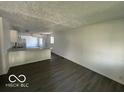 Bright living room featuring hardwood floors and a view into the kitchen at 2914 Baltimore Ave, Indianapolis, IN 46218