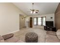 Spacious living room features neutral carpet, ceiling fan, and plenty of natural light at 31 Morningside Ct, Whiteland, IN 46184