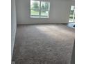 Inviting living room featuring neutral carpeting, offering a comfortable and versatile space to relax and enjoy at 3142 Lennon Ln, Indianapolis, IN 46235