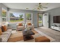 Inviting living room with neutral tones, comfortable seating, and ample natural light at 320 Sunset Dr, Shelbyville, IN 46176