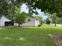 Cozy single-story home with a neat lawn, complemented by shade trees and tasteful landscaping at 411 N 18Th St, Noblesville, IN 46060
