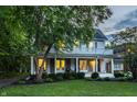 Two-story home boasting a blue front door, inviting porch, and classic charm at 4130 N Meridian St, Indianapolis, IN 46208