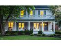 Two-story home boasting a blue front door, inviting porch, and classic charm at 4130 N Meridian St, Indianapolis, IN 46208