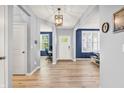 Bright and airy foyer with hardwood floors, neutral paint, and an inviting atmosphere, perfect for welcoming guests at 5353 Hibiscus Dr, Plainfield, IN 46168